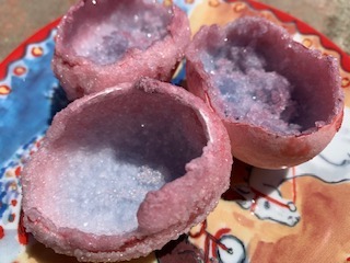 three pink and purple eggshell "geodes"